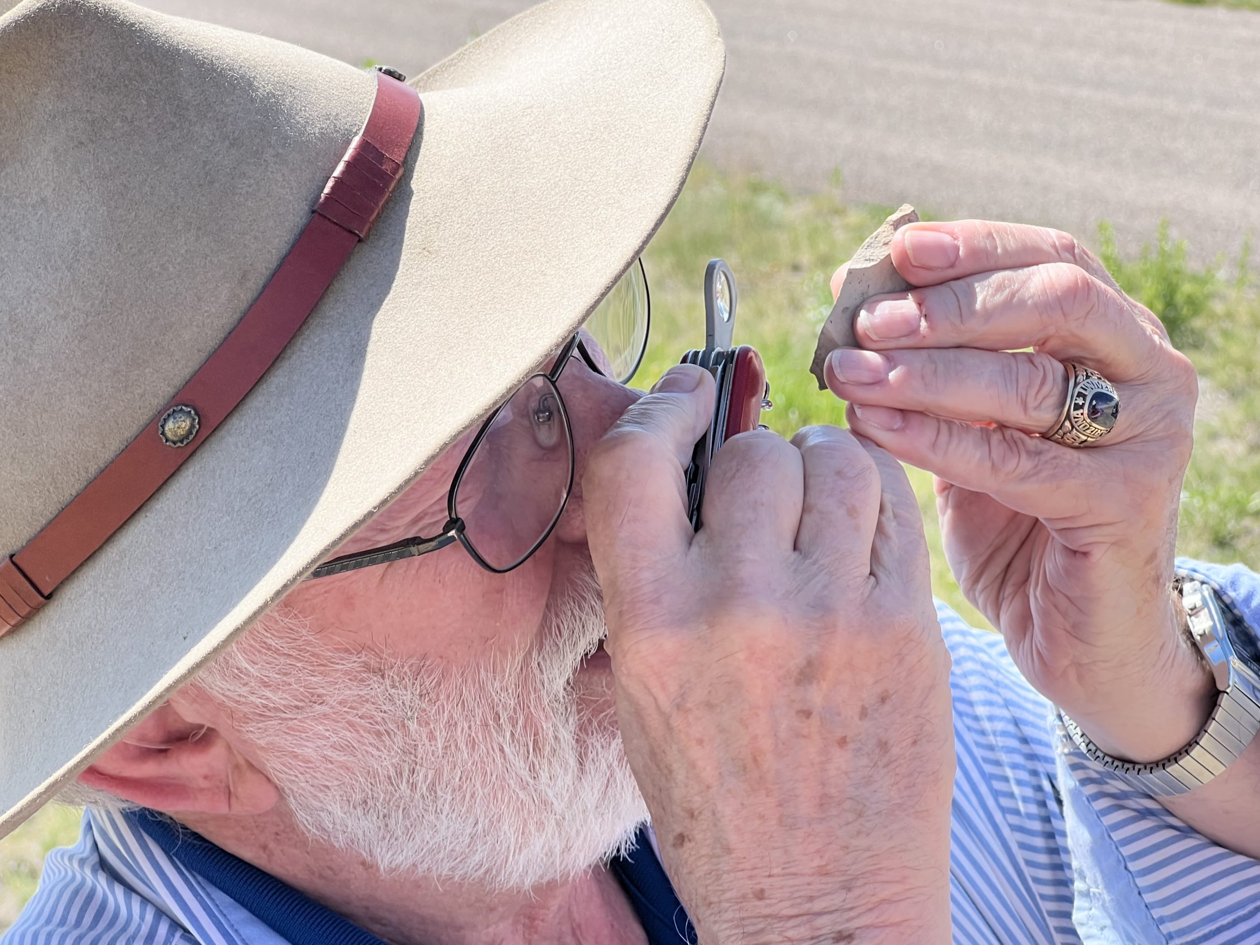Dr. Louis Taylor, Ph.D. examines a fossil at the Tepee Buttes in El Paso County, Colorado.