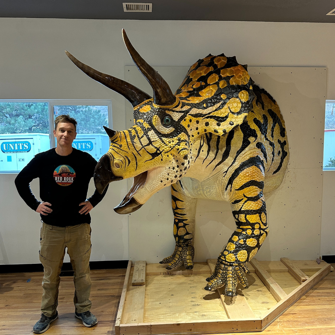 Triceratops sculpture and artist Keegan Kuhn