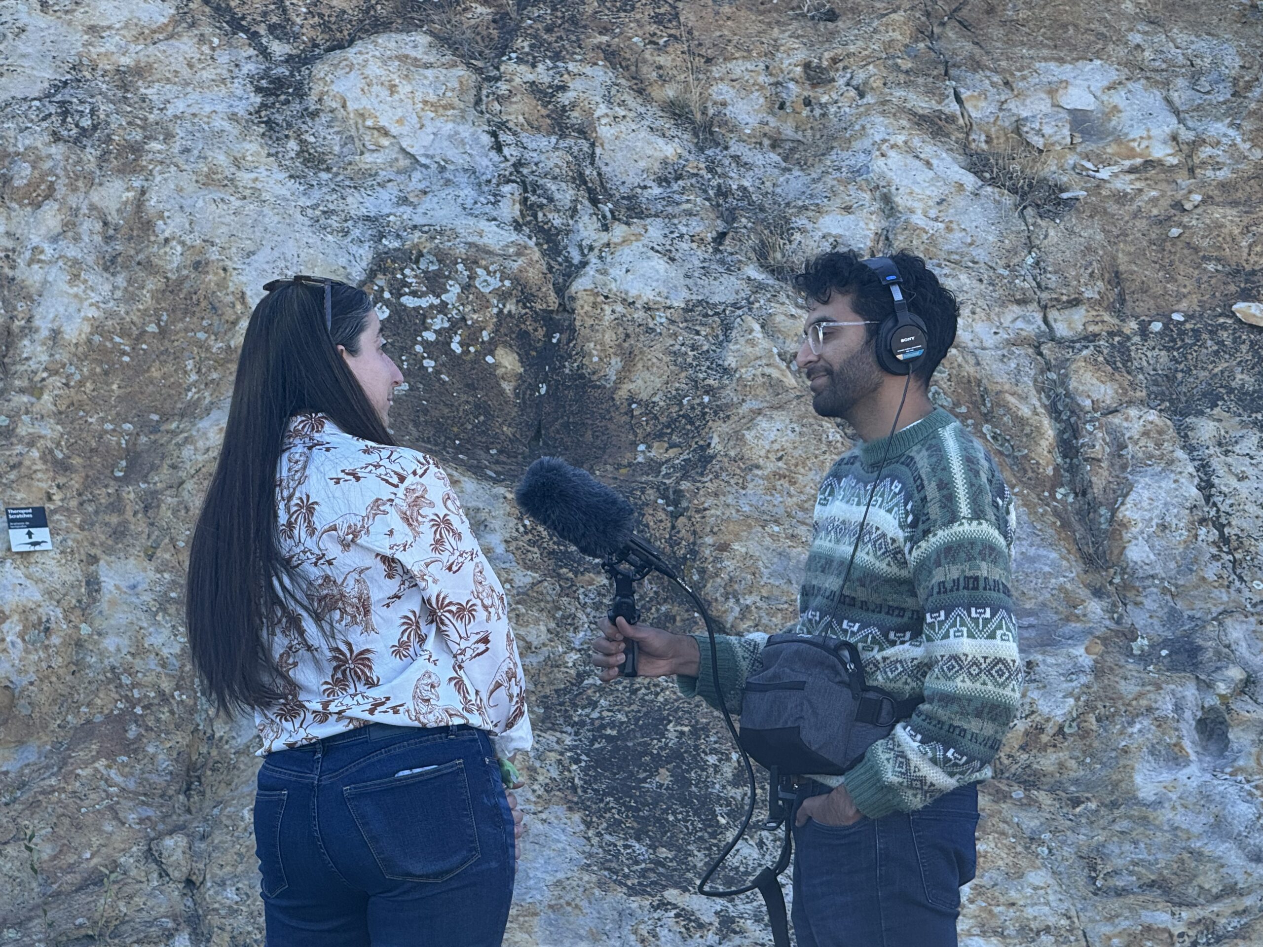Radio reporter interviews Amy Atwater on Dinosaur Ridge.