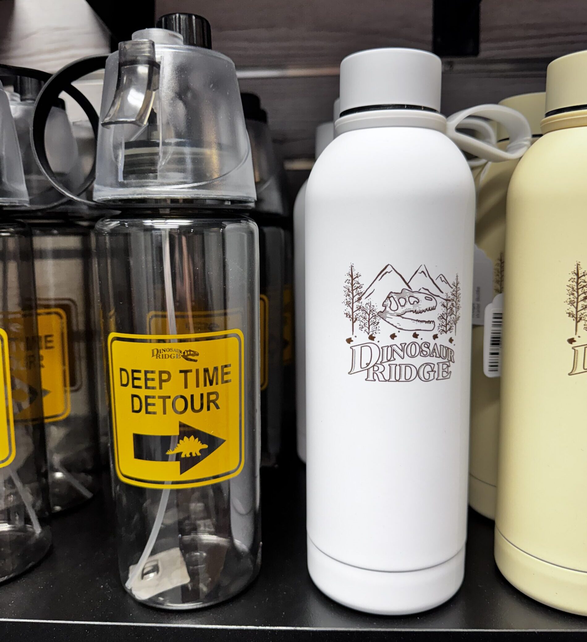 Gift shop water bottles with logos.