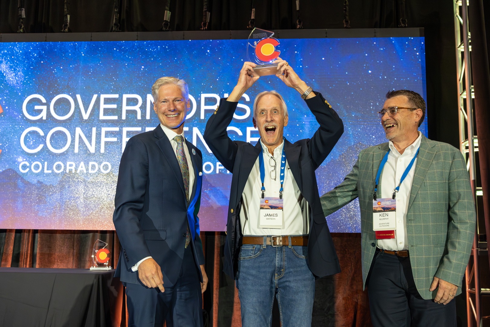 JimWatsonAward Dinosaur Ridge volunteer Jim Watson raises his trophy at the Colorado Governor's Awards.